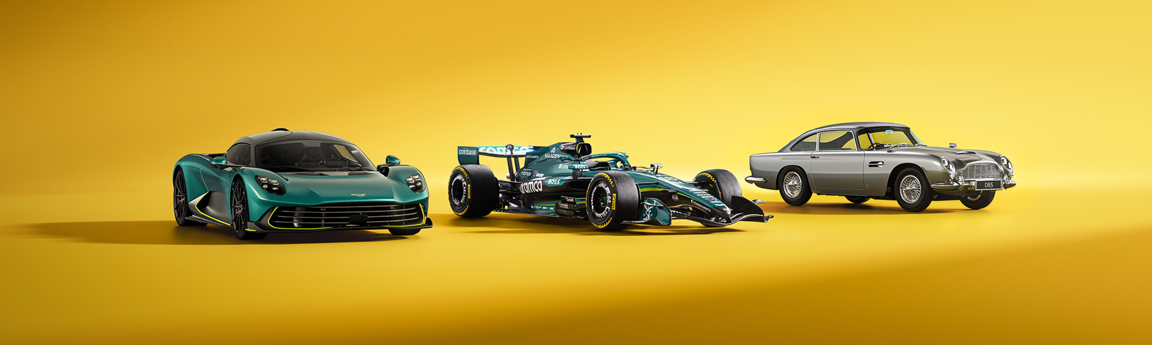 {generated} Sleek dark grey Aston Martin sports car highlighted in a studio setting, emphasising its sculpted lines and dynamic stance