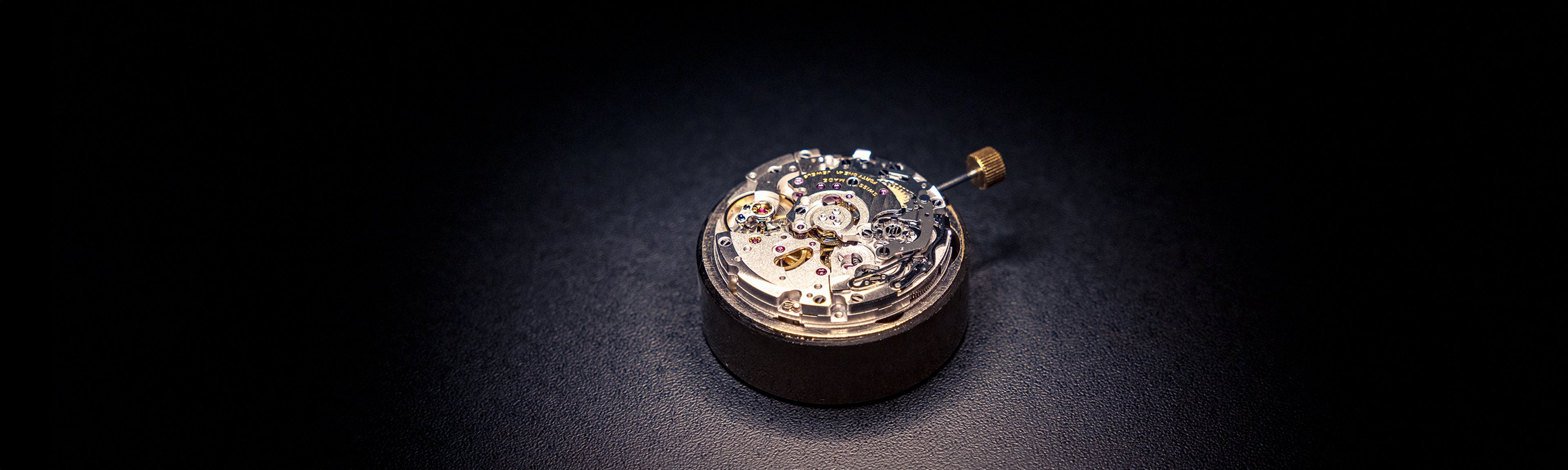 {generated} Breitling mechanical movement set on a dark surface, showcasing fine gears and refined Triumph‑inspired craftsmanship