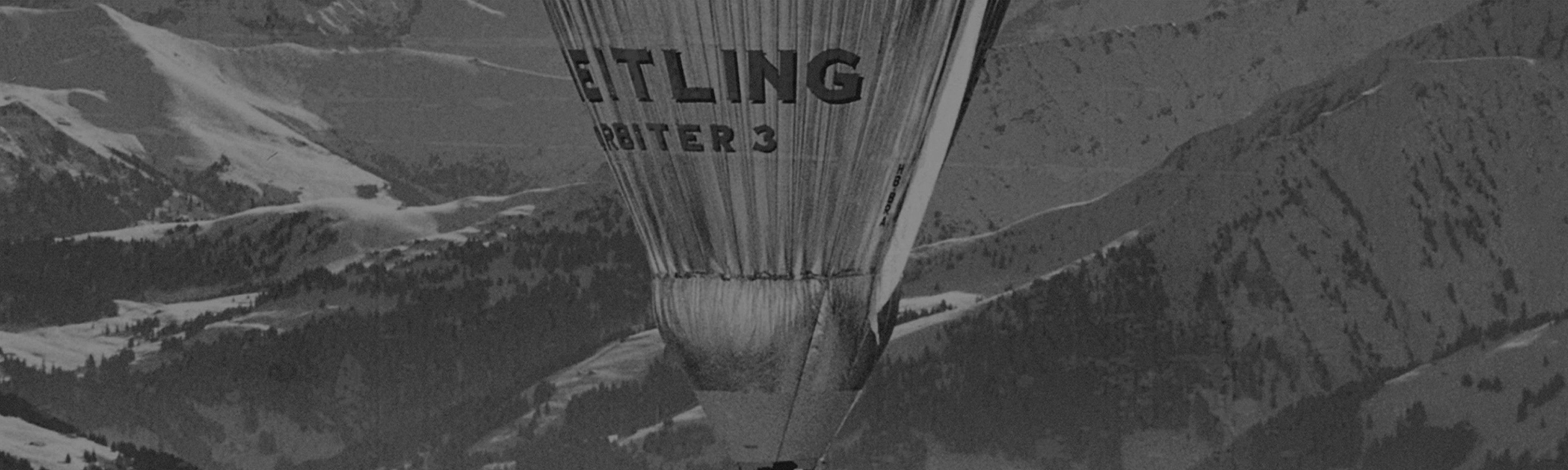 {generated} Breitling熱氣球飛越崎嶇山地景觀,展現專業且富有冒險精神的格調