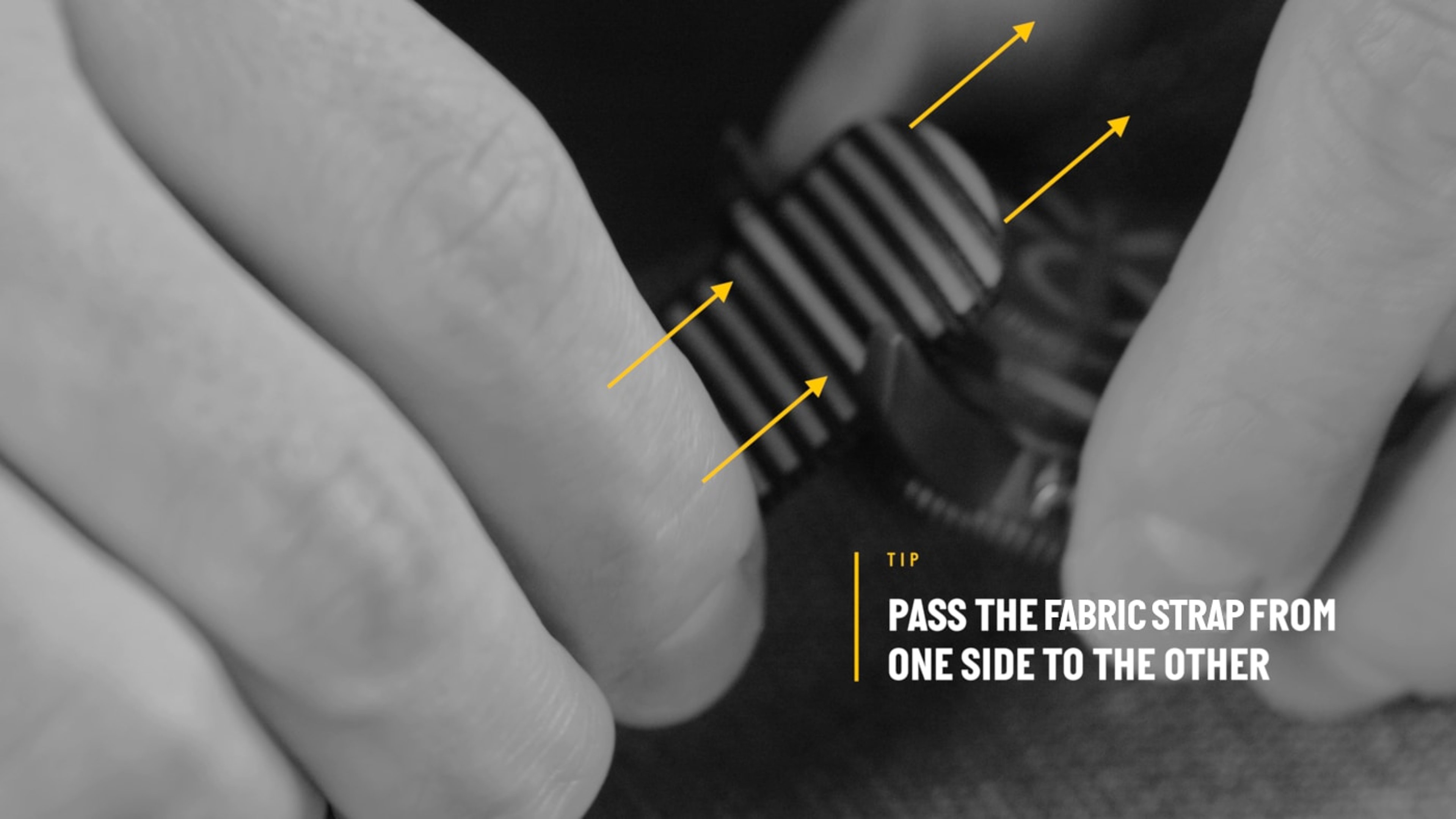 {generated} Hands threading a striped fabric strap through a Breitling watch case, demonstrating how to guide the band securely.