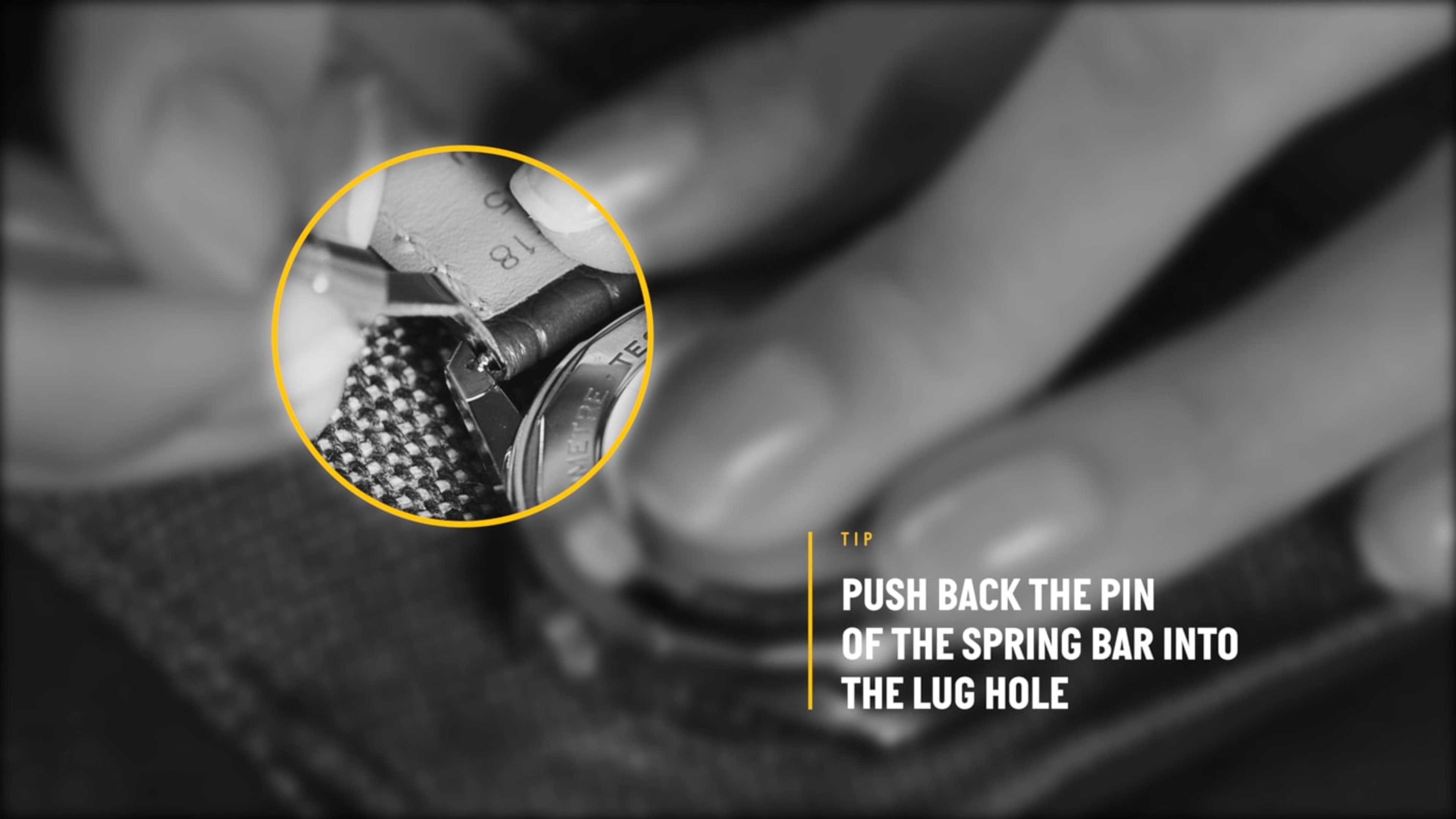 {generated} Close-up hands fitting a Breitling strap as the spring bar pin is guided into the watch’s lug hole for attachment.