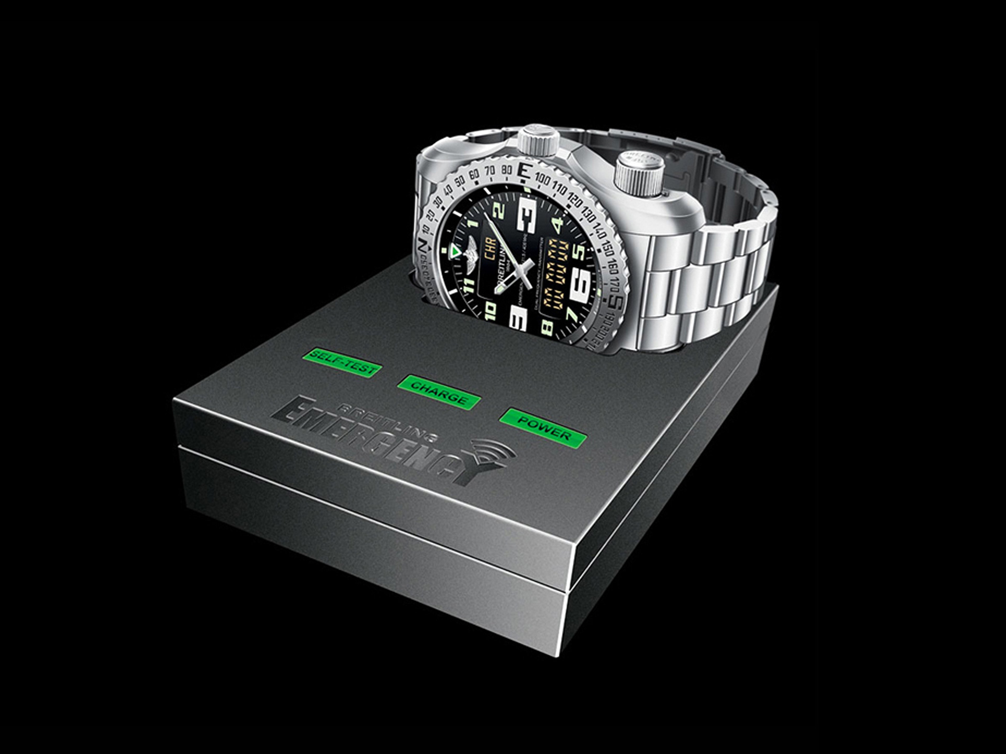 {generated} Breitling Emergency watch on its operation unit, showing the black dial, steel bracelet, and green status indicators.