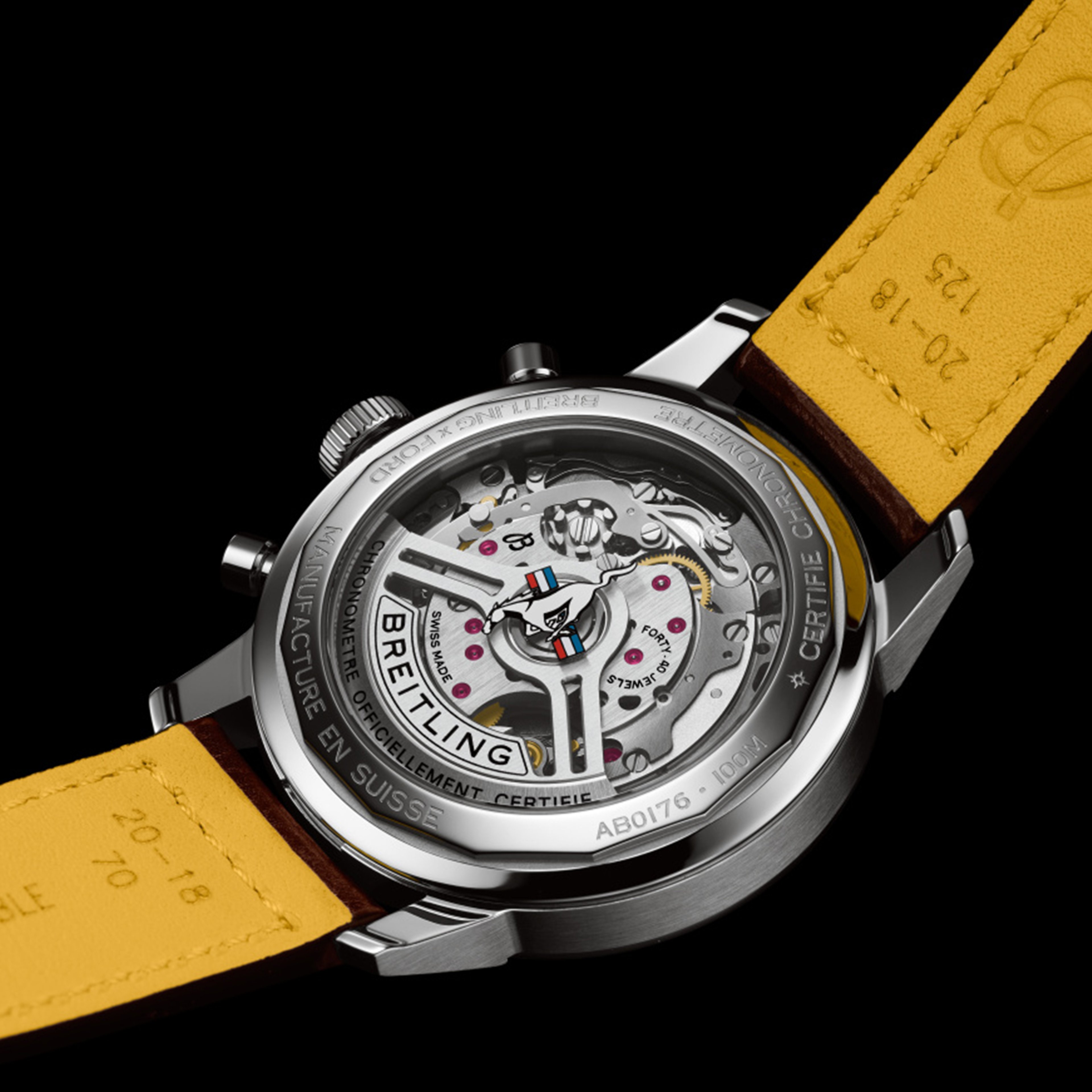 {generated} Breitling caseback reveals the Manufacture Calibre 01 movement with intricate detailing and a yellow leather strap.
