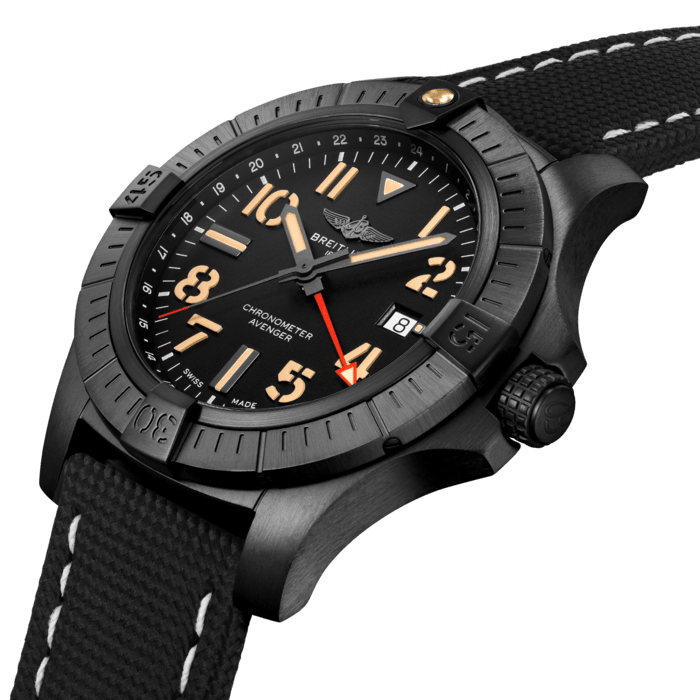 Bold, extremely robust and shock resistant, the Avenger Automatic GMT 45 Night Mission features a lightweight case and an additional red hand indicating a second time zone. As a true Breitling Avenger, it can be used wearing gloves and offers unrivalled safety and reliability to any airborne adventurer. The Night Mission interpretation of the Avenger Automatic GMT 45 features a sturdy 45mm DLC-coated titanium case, black dial and a sand-colored military leather strap that fits either a DLC-coated stainless-steel pin buckle or folding clasp. Its specific Arabic numerals recall the stenciled numbers used on the decks of aircraft carriers. Thanks to its rugged bezel and its special grip-pattern on the crown, the Avenger Automatic GMT 45 Night Mission can be easily operated wearing gloves.