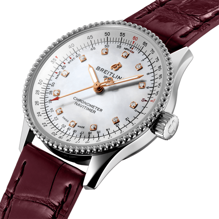 Refined and elegant, the Navitimer Automatic 35 combines the historic appeal of a true icon with the sophistication of a contemporary timepiece.
Available in a variety of materials including stainless steel and 18k red gold, the 35 mm case features a beaded bezel and a range of elegant dial colors, as well as diamond-set white mother of pearl. Offered either with a matching bracelet or alligator strap that fits both a stainless steel pin or folding buckle, the Navitimer Automatic 35 is powered by the Breitling Caliber 17, a COSC-certified chronometer.