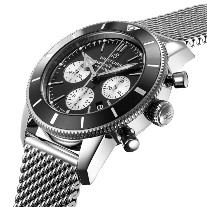 Inspired by the original Superocean from the 1950s, the Superocean Heritage combines iconic design features with a modern touch. Sporty and elegant, the Superocean Heritage is a true embodiment of style at sea.
Featuring the iconic triangular-shaped hands as well as a unidirectional bezel with a polished ceramic ring, the Superocean Heritage is an elegant looking diver’s watch. Available in a variety of materials including stainless steel and 18k red gold, the Superocean Heritage B01 Chronograph 44 features a range of black, blue, silver, or green dials. Offered either with a matching mesh bracelet, or a “mesh-styled” rubber strap fitting a folding buckle, this Superocean Heritage is powered by the in-house Breitling Manufacture Caliber 01, a COSC-certified chronometer.