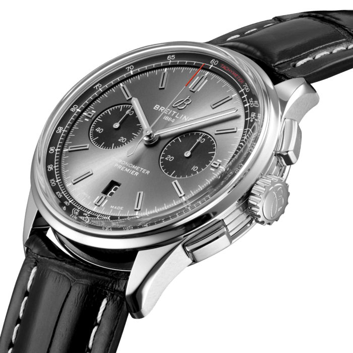 Designed by Willy Breitling in the 1940s, the Premier was the brand’s first-ever watch dedicated purely to style. Featuring elegant details and modern-retro touches, this reinterpretation of the Premier upholds its ancestor’s reputation as “a watch of impeccable taste.” On top of its rectangular chronograph pushers and bi-compax chronograph panda look, the Premier displays a variety of elegant design details such as grooves on the case-side and open sapphire caseback. The Premier B01 Chronograph 42 is available in an array of dial colors and with case materials that include stainless steel and 18k red gold. Offered either with a matching bracelet, or a choice of alligator or nubuck calfskin leather strap, this Premier is powered by the in-house Breitling Manufacture Caliber 01, a COSC-certified chronometer.
