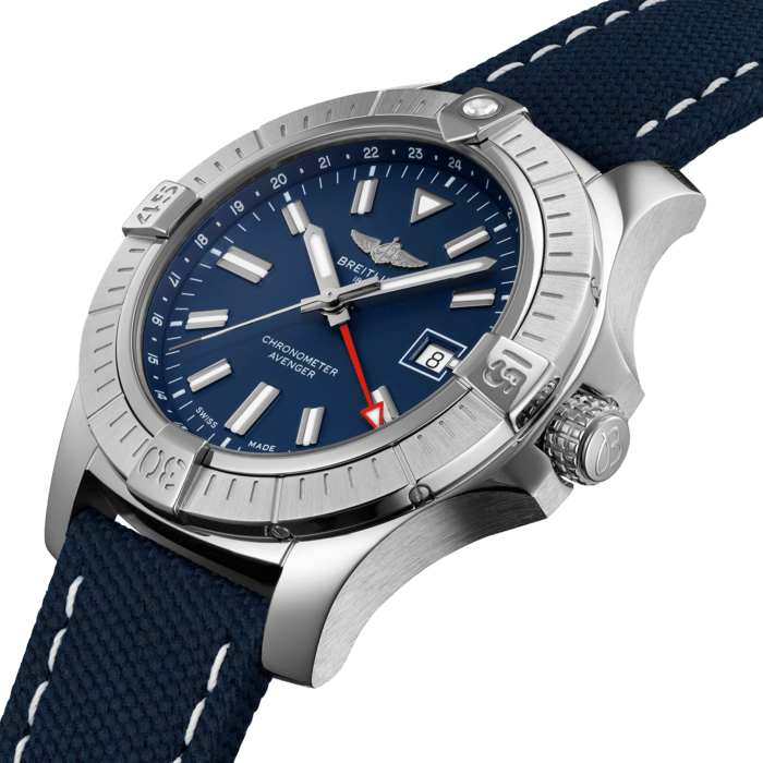 Bold, extremely robust and shock resistant, the Avenger Automatic GMT 45 features an additional red hand indicating a second time zone. As a true Breitling Avenger, it can be used wearing gloves and offers unrivalled safety and reliability to any airborne adventurer. The Avenger Automatic GMT 45 features a sturdy 45mm stainless-steel case, blue dial and a choice of a stainless-steel bracelet, or a blue military leather strap that fits either a stainless-steel pin buckle or folding clasp. Thanks to its rugged bezel and its special grip-pattern on the crown, the Avenger Automatic GMT 45 can be easily operated wearing gloves.