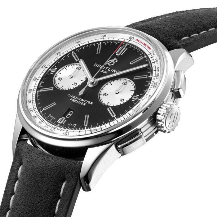 Designed by Willy Breitling in the 1940s, the Premier was the brand’s first-ever watch dedicated to style. Featuring elegant details and modern-retro touches, this reinterpretation of the Premier falls no short of its ancestor’s reputation: it is “a watch of impeccable taste”.
Featuring rectangular chronograph pushers, as well as a bi-compax chronograph panda look, the Premier displays a variety of elegant design details such as the grooves on the case-side or the open sapphire caseback. Available in a variety of materials including stainless steel or 18 k red gold, the Premier B01 Chronograph 42 features a range of bi-compax black, anthracite, silver or blue dials. Offered either with a matching bracelet, or a choice of alligator or nubuck calfskin leather strap fitting both a pin or folding buckle, this Premier is powered by the in-house Breitling Manufacture Caliber 01, a COSC-certified chronometer.