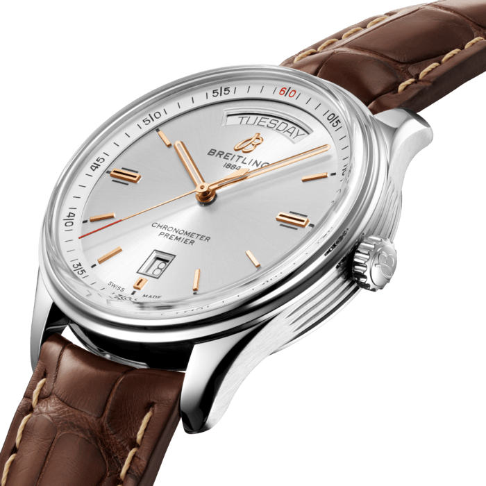 Designed by Willy Breitling in the 1940s, the Premier was the brand’s first-ever watch dedicated to style. Featuring elegant details and modern-retro touches, this reinterpretation of the Premier falls no short of its ancestors reputation: it is “a watch of impeccable taste”.
The Premier displays a variety of elegant design details such as the grooves on the case-side. Available in stainless steel, the Premier Automatic Day & Date 40 features a black or silver dial. Offered either with a matching bracelet, or a choice of alligator or nubuck calfskin leather strap fitting both a pin or folding buckle, this Premier is powered by the Breitling Caliber 45, a COSC-certified chronometer.