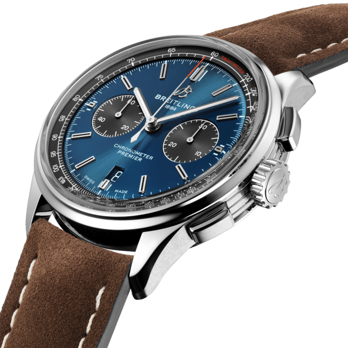 This elegant Premier chronograph features a 42 mm stainless steel case presented on a stylish brown nubuck leather strap. Its striking blue dial is highlighted by contrasting black 30-minute and 12-hour chronograph counters. A transparent sapphire caseback reveals the self-winding high-performance chronometer-certified chronograph caliber, Breitling Manufacture Caliber 01, which is delivered with a five-year warranty. In addition to the version with the brown nubuck strap, the model is also available with a stainless steel seven-row stainless steel bracelet or a blue crocodile leather strap. Elegance and performance worthy of the Breitling Premier name.