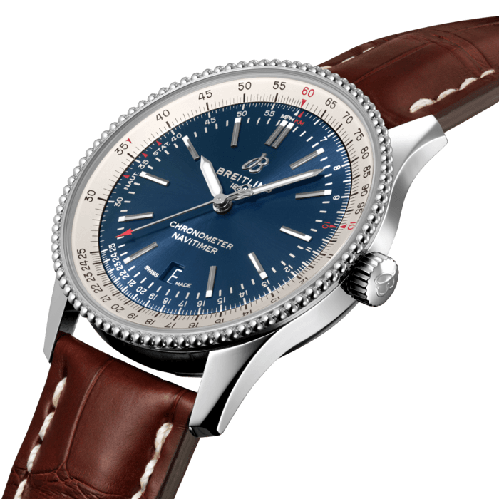 Refined and elegant, the Navitimer Automatic 41 combines the historic appeal of a true icon with the sophistication of a contemporary timepiece.
Available in a variety of materials including stainless steel and 18k red gold, the 41 mm case features a beaded bezel and a range of elegant dial colors. Offered either with a matching bracelet or alligator strap that fits both a stainless-steel pin or folding buckle, the Navitimer Automatic 41 is powered by the Breitling Caliber 17, a COSC-certified chronometer.