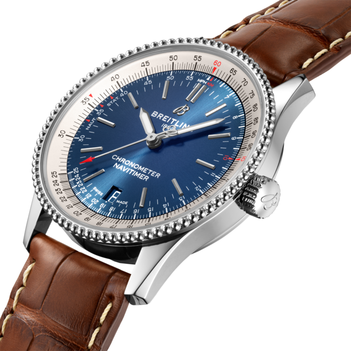 Refined and elegant, the Navitimer Automatic 38 combines the historic appeal of a true icon with the sophistication of a contemporary timepiece.
Available in a variety of materials including stainless steel and 18k red gold, the 38 mm case features a beaded bezel and a range of elegant black, blue or silver dials. Offered either with a matching bracelet, or a black, blue or gold alligator strap that fits both a stainless-steel pin or folding buckle, the Navitimer Automatic 38 is powered by the Breitling Caliber 17, a COSC-certified chronometer.