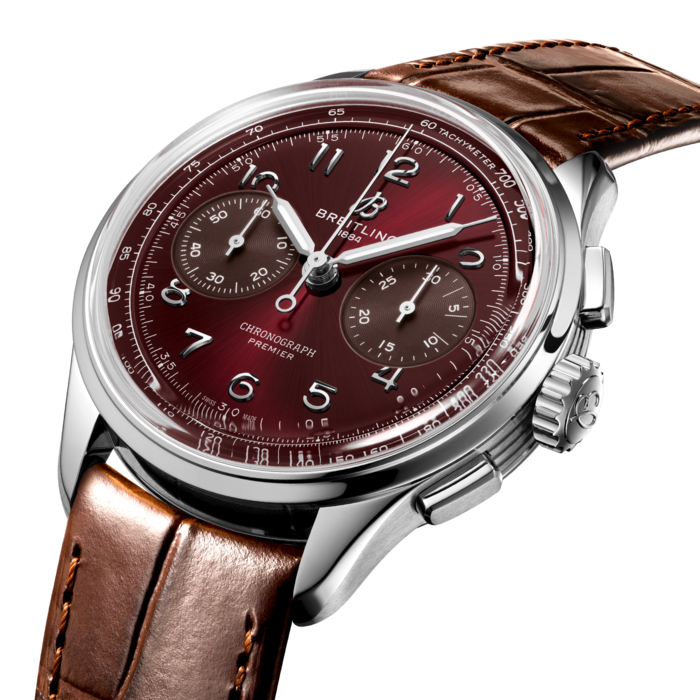 Paying homage to three generations of inventors – Léon, Gaston & Willy Breitling – the Premier Chronograph embodies Breitling’s legacy of inventing the modern Chronograph. As Willy Breitling said, the Premier is an “unmistakable stamp of impeccable taste”. Here in a limited edition of 250 pieces.
This latest generation of Premier chronographs brings its timeless elegance back to life, and showcases Breitling’s highest level of watchmaking thanks to a range of iconic Premier complications: the Chronograph, the Duograph and the Datora.
Featuring rectangular chronograph pushers, bi-compax chronograph look and Arabic numerals, the heritage-revived Premier chronographs display a variety of elegant design details such as grooves on the case-sides, open sapphire casebacks and vintage-inspired hands.
This specific Chronograph comes in a limited edition of 250 pieces, in stainless steel with a bordeaux dial and brown alligator strap. The Chronograph is powered by the manually wound cosc-certified Breitling Manufacture Caliber B09.