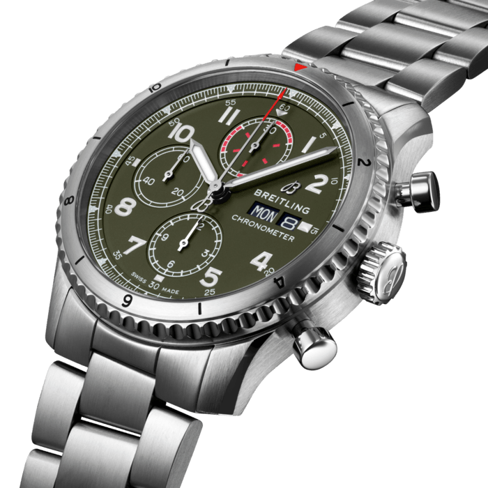 The Aviator 8 Chronograph 43 Curtiss Warhawk features a military green dial with a matte finish and tone-on-tone subdials. Its black nickel-plated hour and minute hands, as well as the large Arabic numerals on the dial, are coated with Super-LumiNova®, whose luminescence makes them easy to read wherever your adventures might take you. Powered by a great mechanical movement, the Breitling Caliber 13, the endurance and outstanding performance of the Aviator 8 Chronograph 43 Curtiss Warhawk are guaranteed. Presented on a military green strap, this chronograph’s robust caseback features a Curtiss inscription and a graphic of the P-40 Warhawk with its electrifying shark mouth logo. This COSC-certified chronometer is water resistant to 10 bar (100 meters) and has a power reserve of approximately 42 hours.