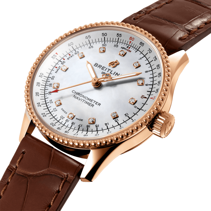 Refined and elegant, the Navitimer Automatic 35 combines the historic appeal of a true icon with the sophistication of a contemporary timepiece.
Available in a variety of materials including stainless steel and 18k red gold, the 35 mm case features a beaded bezel and a range of elegant dial colors, as well as diamond-set white mother of pearl. Offered either with a matching bracelet or alligator strap that fits both a stainless steel pin or folding buckle, the Navitimer Automatic 35 is powered by the Breitling Caliber 17, a COSC-certified chronometer.
