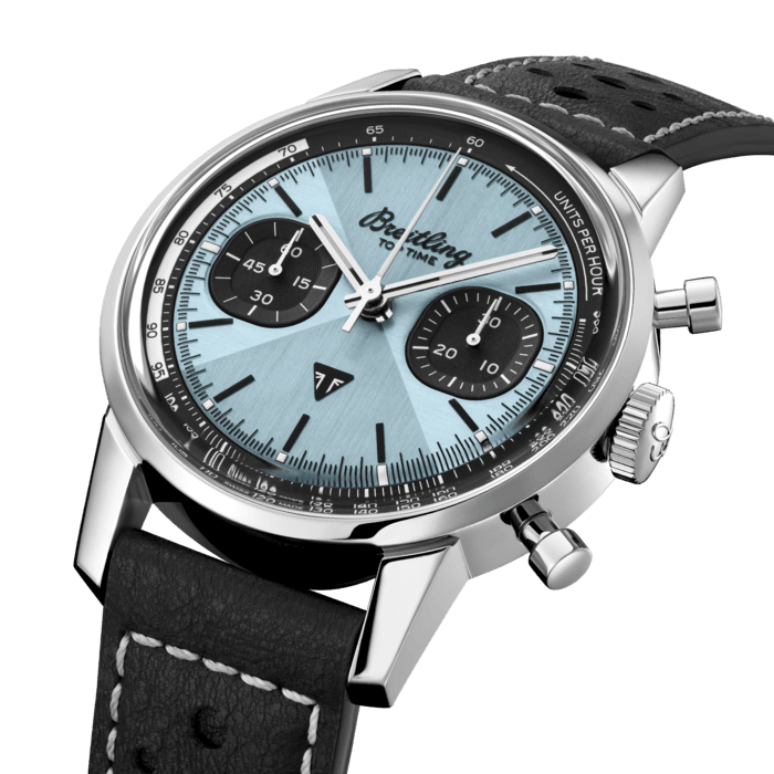 Breitling's unconventional chronograph with a freewheeling 1960s café racer spirit.
In the early 1960s, auto-racing was having a heyday, and a whole subculture had sprung up around “café racers,” stylish motorcycles, used to literally transport their riders from hip café to hip café.
Willy Breitling wanted to capture the speed-driven style of the day with a completely new take on the timekeeper. Enter the Breitling Top Time, an unconventional chronograph that became an instant hit with a sporty in-crowd of men and women equally drawn to the watch’s bold proportions.
Today that freewheeling 1960s spirit is back in a spectacular new Top Time collaboration between Breitling and British motorcycle brand Triumph.
The star of this watch is the ice-blue dial with its striking take on a Top Time motif known as the “Zorro” design. While it usually takes the form of a contrasting color that frames the two sub-counters like the wily swordsman’s mask, here it's achieved with a brushed finish that creates a radiant play of light and texture. The unique ice-blue color has two major archival references: a blue Triumph Thunderbird 6T from 1951 and a rare ice-blue Breitling Top Time Ref. 815 from the 1970s.
Features include oversized mushroom pushers that allow for easy control over the chronograph’s stop-start and reset functions. A high-contrast tachymeter scale provides clear legibility of speed readings. The subdued racing-themed calfskin leather strap lets the hero dial shine, while the Breitling and Triumph logos sit subtly at 12 and 6 o’clock. 41mm, the diameter is, like the original, a fit for both sexes.
For Triumph fans, the Top Time Triumph is an absolute must-have, but you don’t have to have a head-turning motorcycle to fall for this attention-grabbing design. 