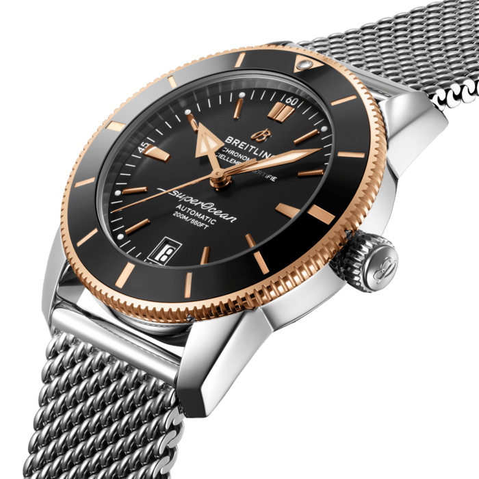 Inspired by the original Superocean from the 1950s, the Superocean Heritage combines iconic design features with a modern touch. Sporty and elegant, the Superocean Heritage is a true embodiment of style at sea.
Featuring the iconic triangular-shaped hands as well as a unidirectional bezel with a polished ceramic ring, the Superocean Heritage is an elegant looking diver’s watch. Available in a variety of sizes and materials including stainless steel and 18k red gold, the Superocean Heritage B20 Automatic features a range of black, blue or green dials. Offered either with a matching mesh bracelet, or a “mesh-styled” rubber strap fitting a folding buckle, this Superocean Heritage is powered by the Breitling Manufacture Caliber B20, a COSC-certified chronometer based on the Tudor Caliber MT5612.