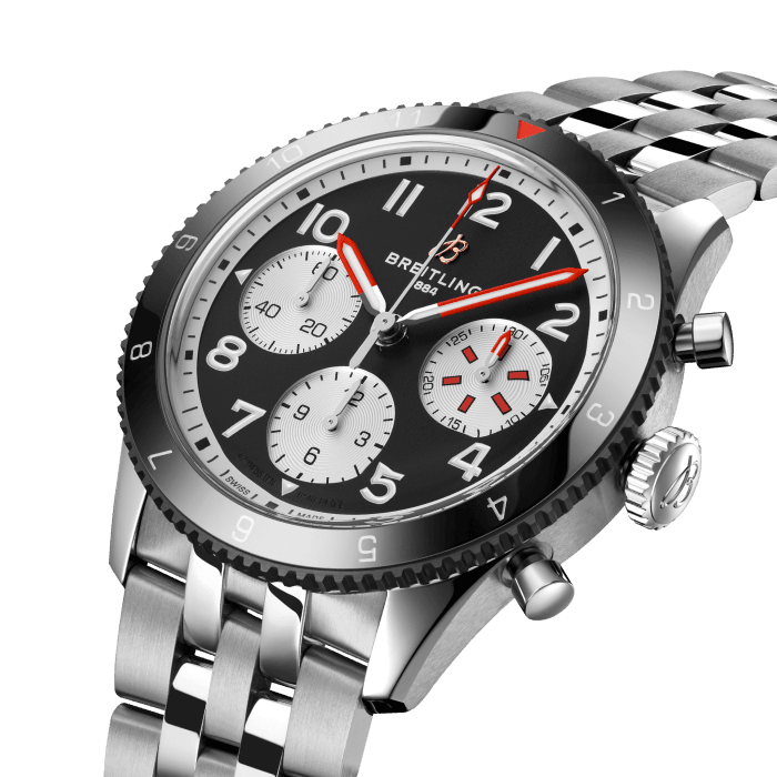 From brave first takeoffs to the birth of commercial air travel, Breitling’s history is inseparable from that of flight. In the 1930s, Breitling’s Huit Aviation department made its name inventing precision cockpit clocks. Two decades later, it introduced yet another novel flight instrument, this time in wearable form: the Ref. 765 AVI. That pioneering pilot’s watch provided the technical backdrop for today’s Classic AVI, a collection inspired by the rugged spirit of famed early aircraft.
The Classic AVI Mosquito honors one of those legends. In an era when aluminum and steel shortages were common, the engineers behind the de Havilland Mosquito made use of a still plentiful material: wood. The “Wooden Wonder” caused shockwaves when it outperformed its metal contemporaries to become one of the fastest planes built between 1940 and 1950. Its superior maneuverability allowed it to multitask in roles as far ranging as light bomber, night-fighter, transport and photographic reconnaissance aircraft.
As a true pilot’s watch designed to withstand the rigors of a vintage cockpit, the Classic AVI Mosquito features large, highly legible Arabic numerals on the dial and bezel.
The knurled bezel on the 42mm case provides optimal grip, even in a pilot’s gloved hands. Top-stitched calfskin straps give a nod to the seams found on classic flight gear, while the stainless-steel bracelet provides an elegant alternative. Pilots and other travelers will appreciate its legibility, wearability, and understated style. The engine of the Classic AVI is the COSC-certified Breitling Caliber 23 movement, which provides approximately 48-hours of power reserve.